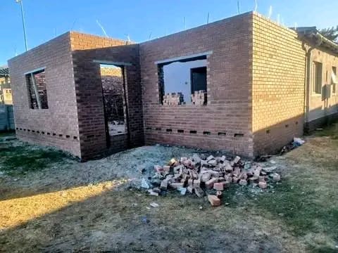 Brick shell of a new house with window openings